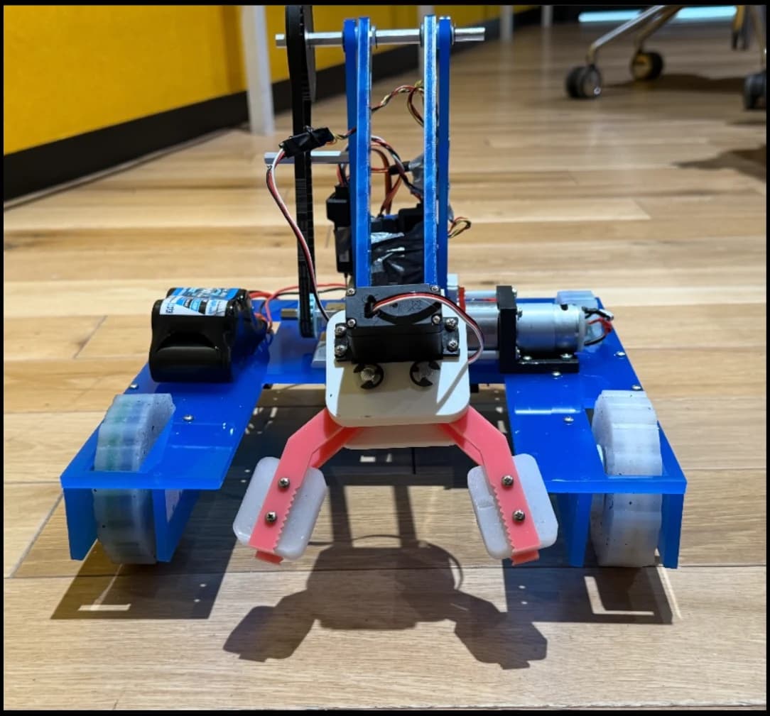 Completed robot showing the arm and fabricated chassis