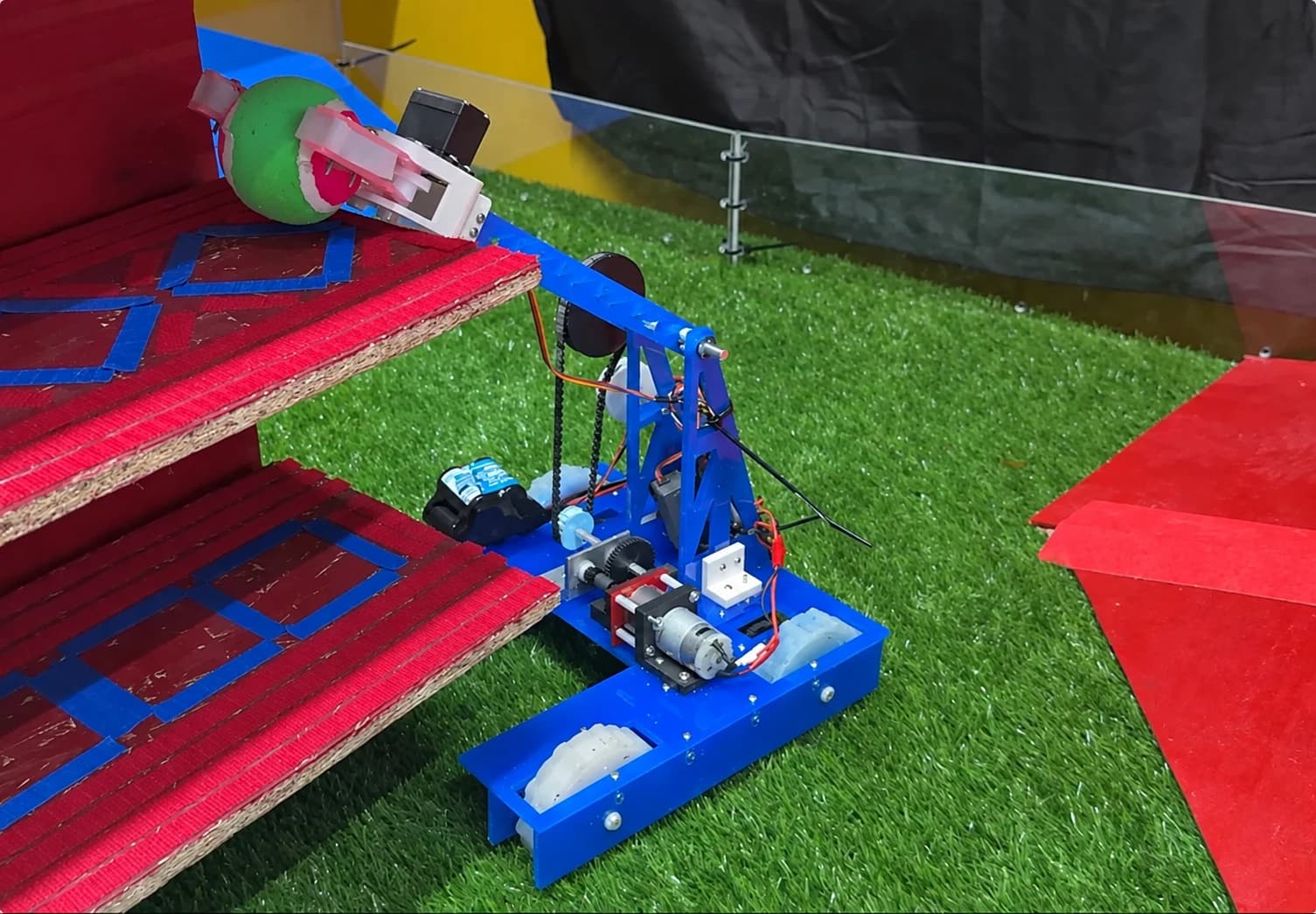 LeBot James placing an object into an elevated competition goal